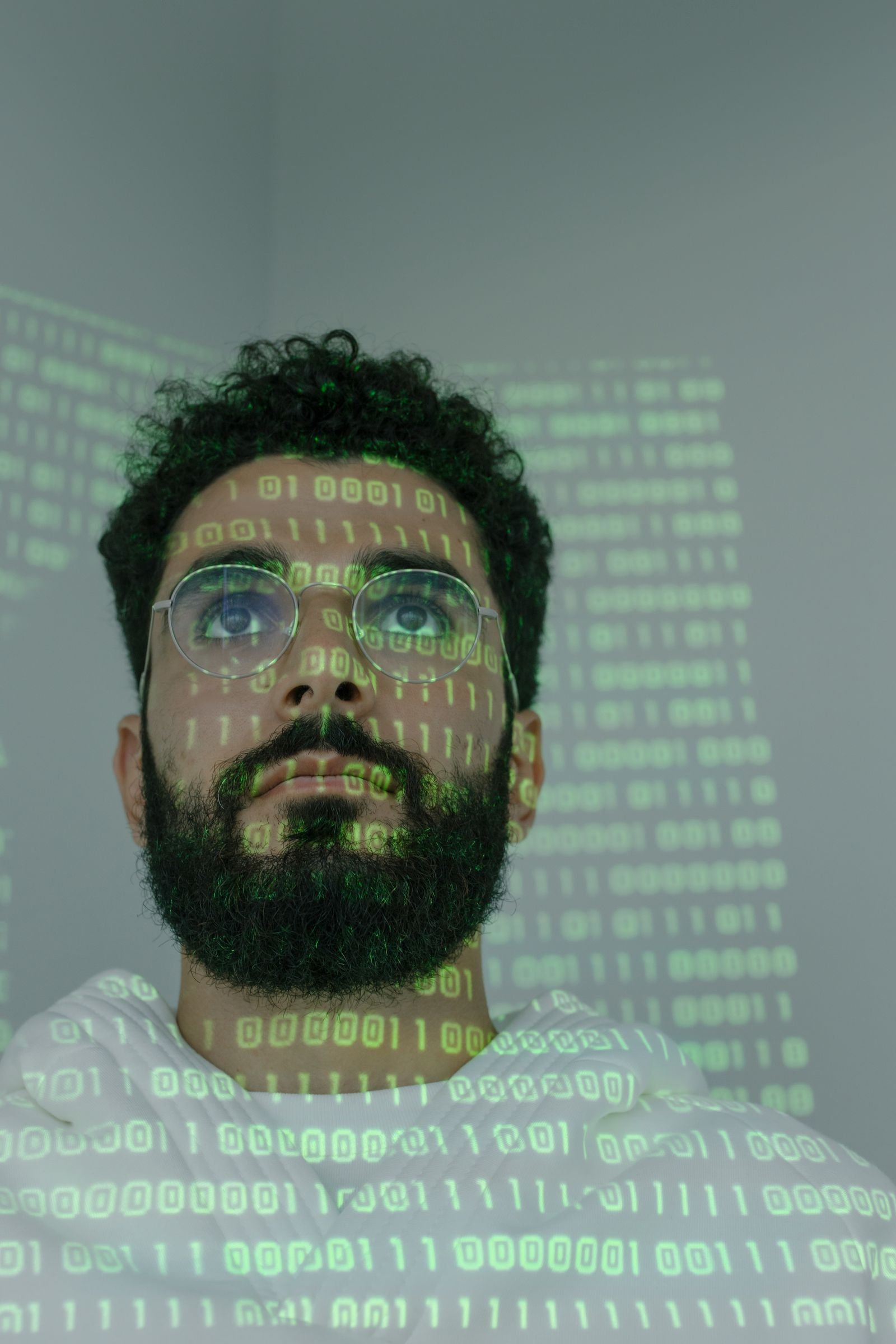 Code projected across a security analyst's face