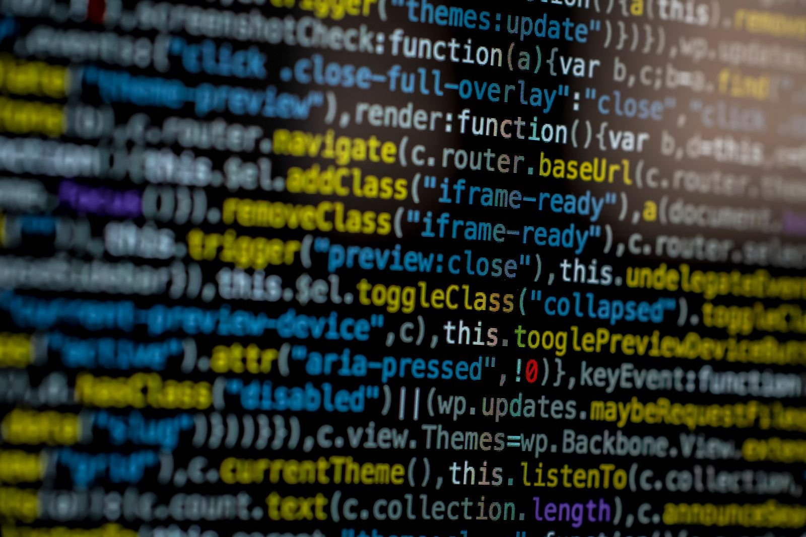 Wall of dense source code on a dark screen